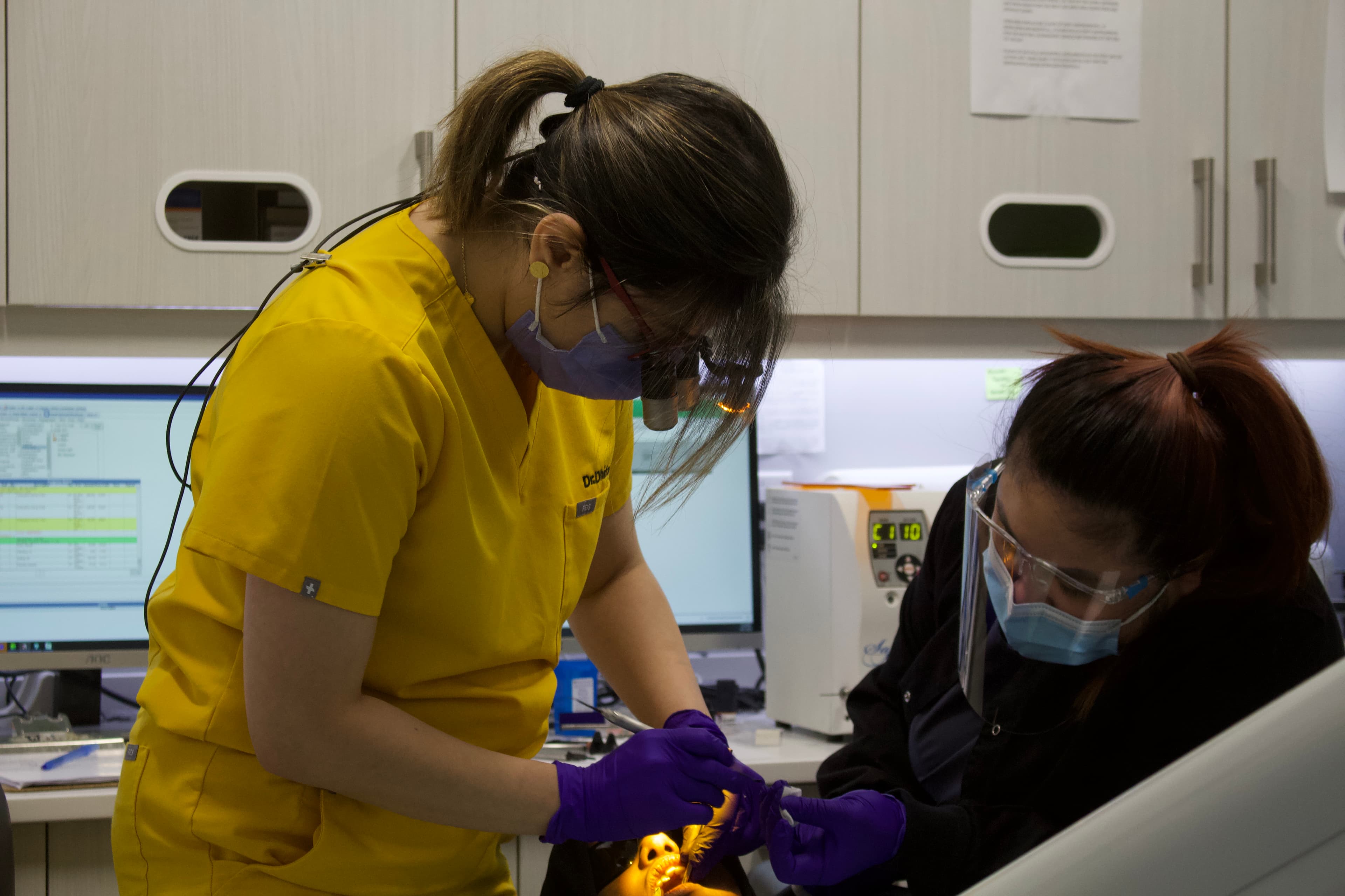 Bal Dental Centre dentist and assistant treating a patient in Scarborough