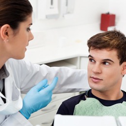 A dentist talking to a patient